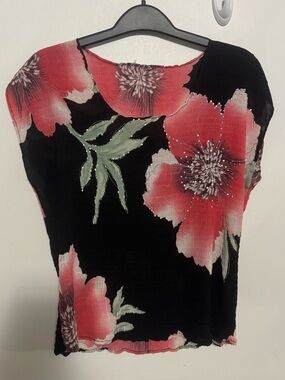 Y2K top. With flowers and embellishments.